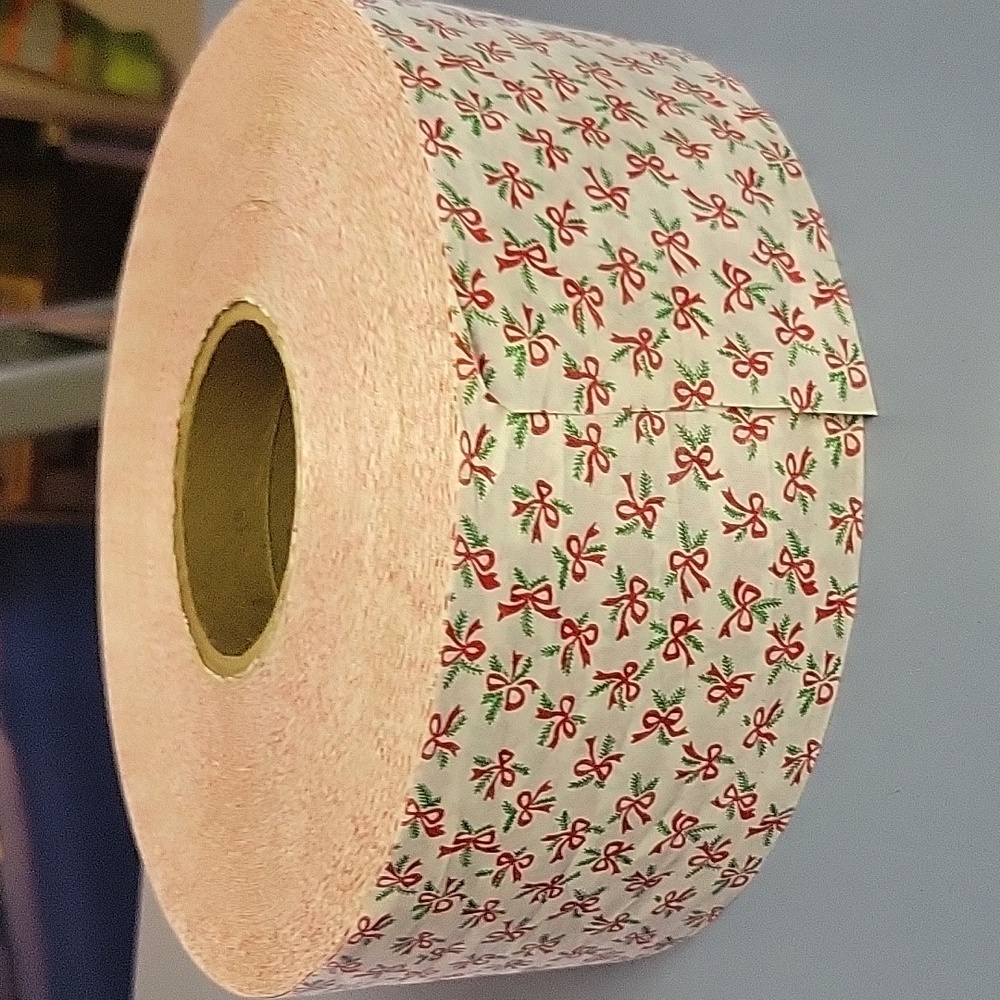 Big Roll of Christmas ribbon White with Red bows.